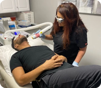 ReEnvision Aesthetics and MedSpa Teammember Treating Banner